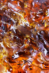 Brown rosin for soldering in a jar, background