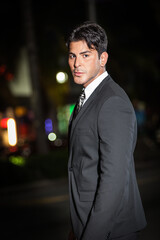 Fashionable man in the street at night, Miami Beach, Florida, USA