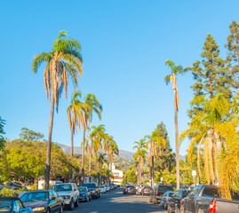 Narrow street in Santa Barbara under a blue sky - obrazy, fototapety, plakaty