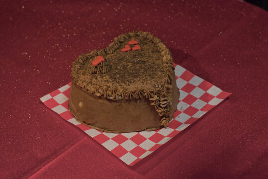 Heart shaped chocolate cake on graph paper