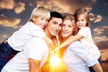 Happy young family have fun in the park.