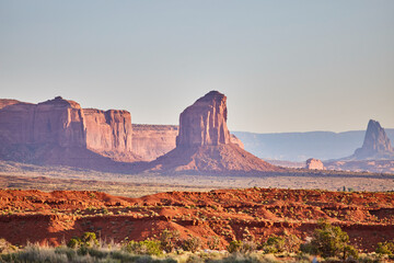 Fototapeta premium Golden Hour Glow on Red Sandstone Buttes, Monument Valley