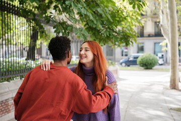 Obraz premium Two young people greeting each other outdoors after meeting through dating apps