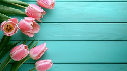 A beautiful frame composition of spring flowers. Fresh colorful tulip flowers on turquoise blue vintage wooden background with space for text