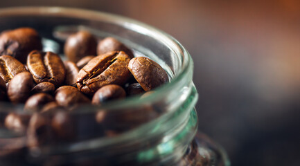 coffee beans are in a jar, ready to be ground