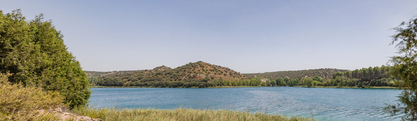 Fototapeta premium Lagunas de Ruidera located in Albacete Spain, with turquoise waters and blue sky