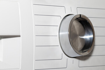 This image captures the detailed control panel of a modern washing machine, highlighting the settings for fabric care and cleaning cycles. Clean panel with no text