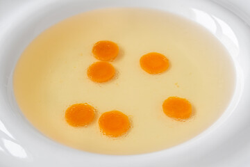 Chicken broth in plate