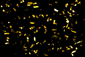 Gold Confetti On A Black Background