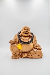 Fototapeta na wymiar Dicker Buddha aus Holz