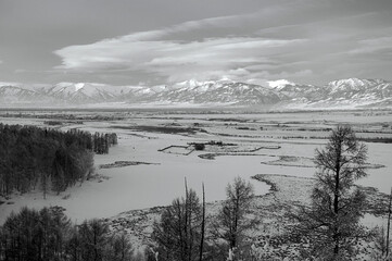 Fototapeta premium Cold snowy mountain landscape at sunset.