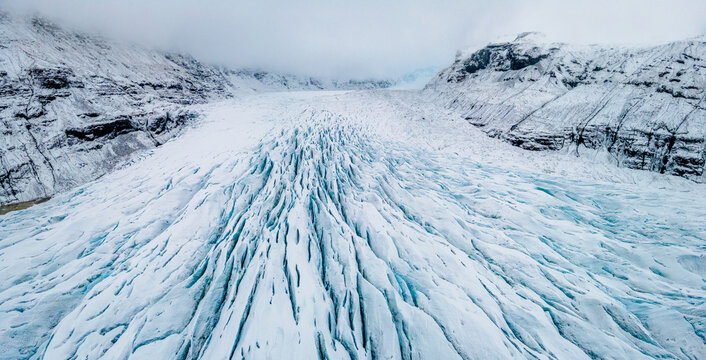 Aerial winter panorama of the snowy Svinafell Glacier in Iceland