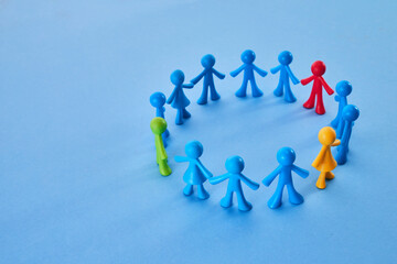 Diversity and inclusion concept. Colorful figurines on blue background