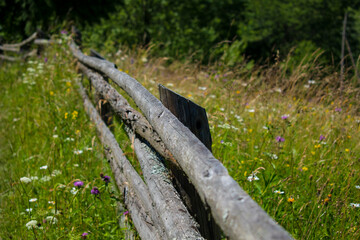 log fence in a mountain village in Ukraine