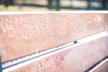 drops of water on a bench after rain