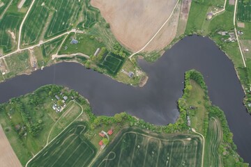 A photo of a homestead by the river from the sky