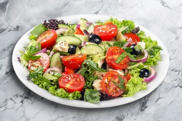 Tasty fresh salad with vegetables on the desk