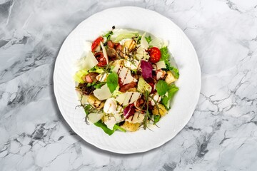 Tasty fresh salad with vegetables on the desk