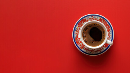 Top view of a traditional turkish coffee with porcelain cup isolated on red background. - obrazy, fototapety, plakaty