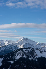 Obraz premium Panorama of a snow covered mountain lake. Winter mountain snow lake. Lake in snowy mountains. Mountain lake in snow