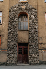 old wall with windows and doors