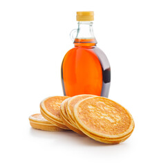 Pancakes and maple syrup in bottle isolated on white backgorund.