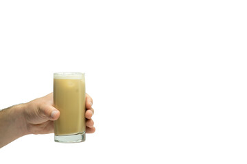 Hand holding transparent glass cup with latte macchiato coffee isolated on white background
