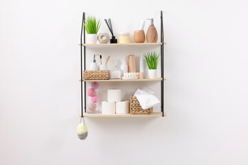 Different bath accessories, personal care products and artificial plants indoors