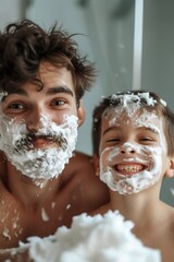 Father and son shaving together. Father and Son. Parenthood concept. Family at Home. Shaving man. Healthcare and hygiene concept. Little boy.