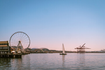 Seattle skyline with Waterfront neighborhood and ferris wheel in foreground.
