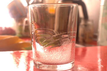 glass of water  with foam on the table