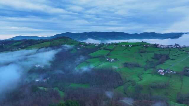 Aerial drone view of the winter landscape around the town of Gainza and Amezqueta and the Txindoki Mountain. Aralar Mountain Range. Goierri region. Gipuzkoa. Basque Country. Spain. Europe