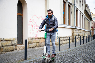 man riding electric roller in the city