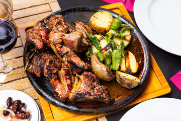Tasty piece of grilled beef served with potatoes and pepper