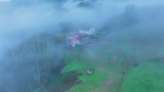 Aerial drone view of the winter landscape around the town of Gainza and Amezqueta and the Txindoki Mountain. Aralar Mountain Range. Goierri region. Gipuzkoa. Basque Country. Spain. Europe