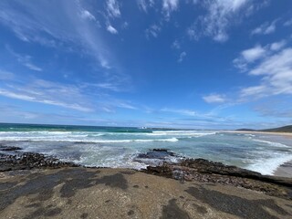 Fototapeta na wymiar Seascape of an Australian coastline with rocky foregraound and big sky.