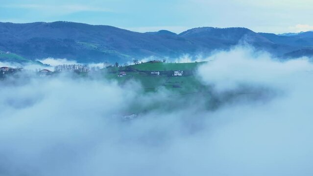 Aerial drone view of the winter landscape around the town of Gainza and Amezqueta and the Txindoki Mountain. Aralar Mountain Range. Goierri region. Gipuzkoa. Basque Country. Spain. Europe