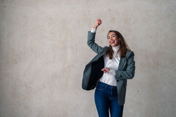 Studio shot of a happy young woman enjoying her favorite music track.