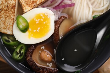 Delicious vegetarian ramen in bowl, top view