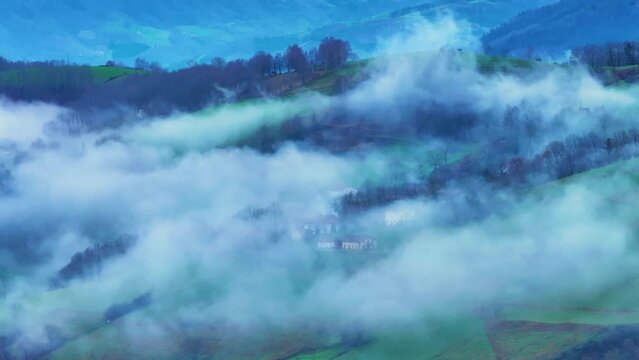 Aerial drone view of the winter landscape around the town of Gainza and Amezqueta and the Txindoki Mountain. Aralar Mountain Range. Goierri region. Gipuzkoa. Basque Country. Spain. Europe