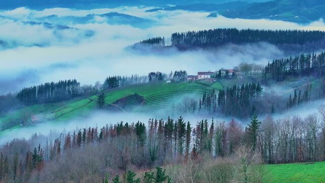 Aerial drone view of the winter landscape around the town of Gainza and Amezqueta and the Txindoki Mountain. Aralar Mountain Range. Goierri region. Gipuzkoa. Basque Country. Spain. Europe