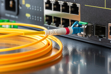 Fiber optic patch cord cable connected to switch in office internet network
