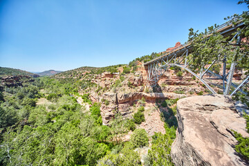 Fototapeta na wymiar Steel Bridge Spanning Canyon in Sedona Landscape, High Angle View