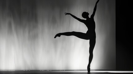  a black and white photo of a ballerina in the middle of a dance pose with her arms in the air and her leg in the air with her right hand.