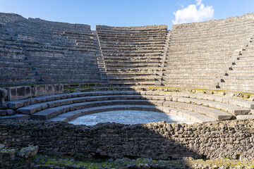 small theater, half shade and sun in pompeii archeological park.