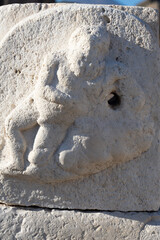 Human figure carved in water fountain stone in Pompeii Archaeological Park