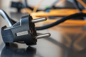 Electric plug close-up with power supply cord cable