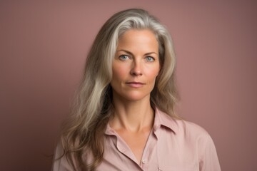 Portrait of a beautiful middle-aged woman with grey hair.