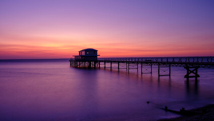 Fototapeta na wymiar Totland Pier at sunset, Isle of Wight