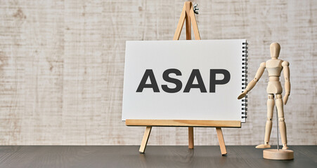 There is notebook with the word ASAP. It is an abbreviation for As soon as possible as eye-catching image. - obrazy, fototapety, plakaty